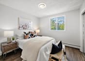 Thumbnail 41 of 53 - a bedroom with a large bed and a window