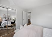 Thumbnail 48 of 53 - a bedroom with a large bed and a large mirror