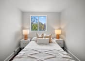 Thumbnail 46 of 53 - a bedroom with a large bed and two night stands with lamps