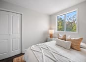 Thumbnail 39 of 53 - a bedroom with a bed and a window