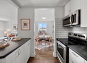 Thumbnail 44 of 53 - a kitchen and dining area in a 555 waverly unit