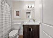 Thumbnail 26 of 53 - a bathroom with a toilet sink and shower