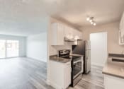 Thumbnail 3 of 24 - a kitchen and living room in an apartment