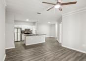 Thumbnail 13 of 35 - A spacious kitchen with a fan on the ceiling.