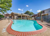 Thumbnail 9 of 46 - a swimming pool with a fence and a house with a pool