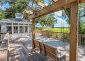 Thumbnail 14 of 20 - a large deck with a swing and a gazebo