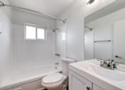 Thumbnail 12 of 24 - a bathroom with a bathtub toilet and sink