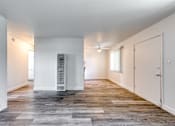 Thumbnail 13 of 24 - a bedroom with hardwood floors and white walls