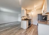 Thumbnail 8 of 24 - a kitchen and living room in a 555 waverly unit