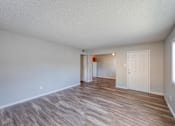 Thumbnail 11 of 17 - a spacious living room with hardwood flooring