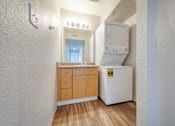 Thumbnail 6 of 17 - a room with a washer and dryer in it