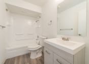 Thumbnail 20 of 25 - a bathroom with a sink toilet and bathtub in a 555 waverly unit