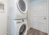 Thumbnail 15 of 25 - a washer and dryer in a laundry room