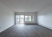 Thumbnail 13 of 41 - an empty living room with a sliding glass door