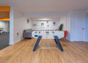 Thumbnail 23 of 41 - a games room with a foosball table