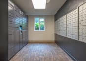 Thumbnail 34 of 41 - a photo of the inside of a mailroom with lockers and a window