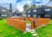 Thumbnail 2 of 25 - a wooden privacy fence with a fire hydrant in the background