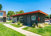 Thumbnail 16 of 36 - a black building with a red roof