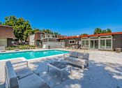 Thumbnail 18 of 36 - take a dip in the pool at the whispering winds apartments in pearland, tx