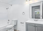 Thumbnail 30 of 42 - a bathroom with a sink toilet and bathtub