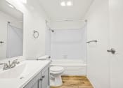Thumbnail 27 of 42 - a bathroom with a toilet sink and bathtub