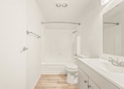 Thumbnail 6 of 42 - a bathroom with a toilet sink and bathtub