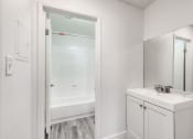 Thumbnail 15 of 24 - a bathroom with a sink and a bathtub