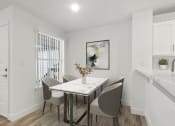 Thumbnail 5 of 20 - a dining room with a table and chairs