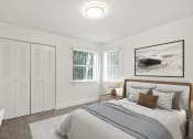 Thumbnail 7 of 20 - a bedroom with a bed and two windows