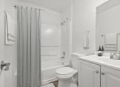 Thumbnail 8 of 20 - a white bathroom with a shower toilet and sink