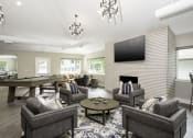 Thumbnail 14 of 17 - a resident clubhouse with a pool table and flat screen tv