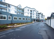 Thumbnail 39 of 42 - an empty street in front of an apartment building