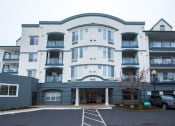 Thumbnail 37 of 42 - the apartment building has a parking lot in front of it