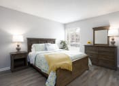 Thumbnail 15 of 43 - a bedroom with a bed and dressers and a window