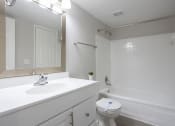 Thumbnail 31 of 43 - a bathroom with a sink toilet and a tub