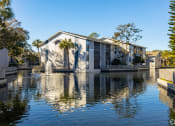 Thumbnail 40 of 43 - the building where the motel is located has a fountain in the water