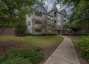 Thumbnail 8 of 34 - an apartment building with a sidewalk in front of it