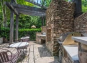 Thumbnail 3 of 34 - the patio has a pizza oven and tables and chairs