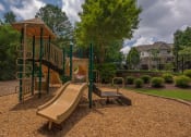 Thumbnail 31 of 34 - a playground with a slide and a swing set