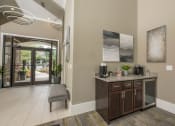 Thumbnail 29 of 34 - the lobby of a home with a counter and a door to a patio