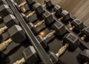 Thumbnail 26 of 34 - a row of weights on a gym machine