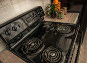Thumbnail 23 of 34 - the stove in the kitchen is clean and ready to use