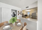 Thumbnail 9 of 33 - a kitchen and dining room with a table and chairs