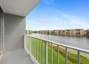 Thumbnail 25 of 33 - the views of the water from the balcony of an apartment building with a river