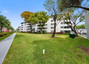 Thumbnail 2 of 33 - the preserve at ballantyne commons apartments courtyard with grass and trees