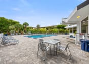 Thumbnail 4 of 33 - the pool area of a house with a swimming pool and patio furniture