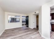 Thumbnail 4 of 9 - a bedroom with hardwood flooring and white walls