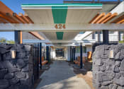 Thumbnail 22 of 24 - a view of the front of the building with stone walls and awnings