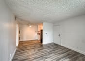 Thumbnail 8 of 36 - a bedroom with hardwood flooring and white walls