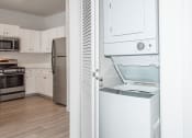 Thumbnail 20 of 42 - an empty kitchen with a washer and dryer in it